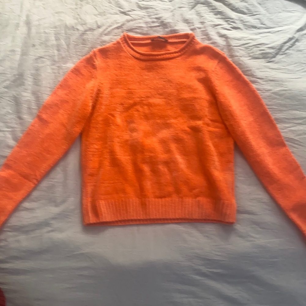 Beautiful, orange sweater.Good for layering, never worn. Statement piece.